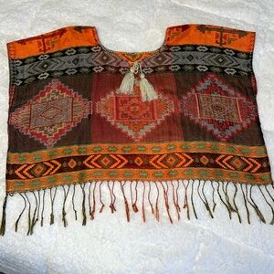 Handmade multi colored Mexican Blouse/croptop.
Fits Xs to M.